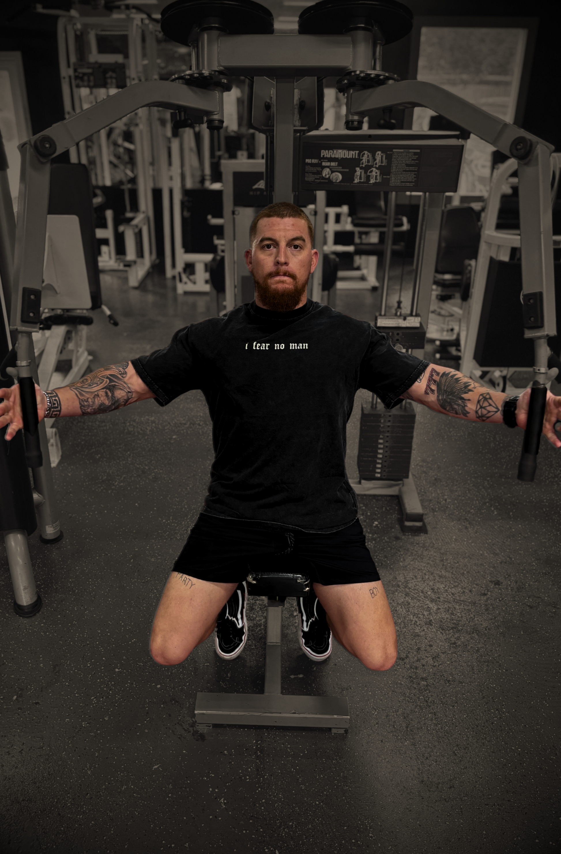 Front shot of model exercising in gym wearing FEARLESS FAITH Oversized Christian Tee — live unshaken
