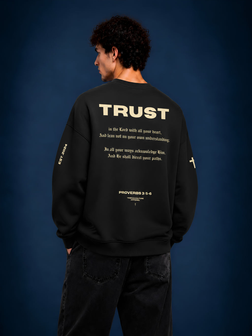 Man wearing TRUST Christian crewneck sweater by Yeshua Culture Apparel, Proverbs 3:5-6 back design