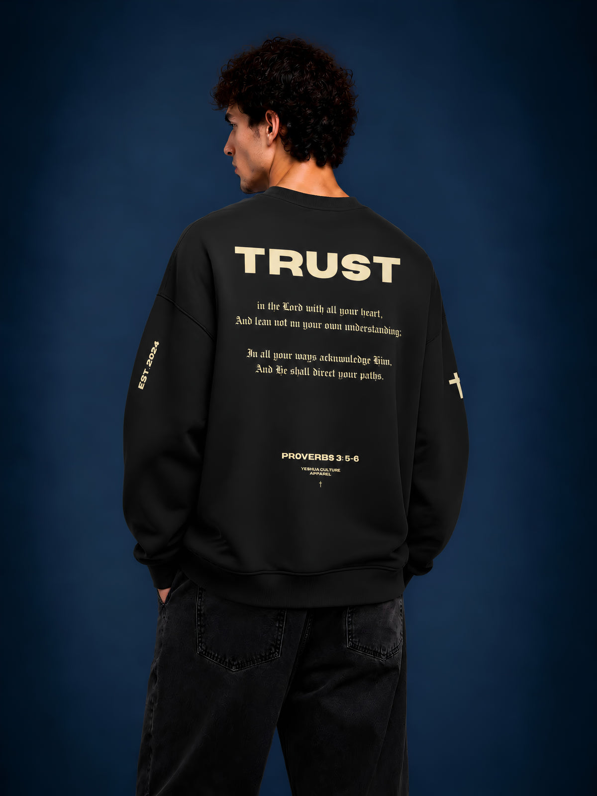 Man wearing TRUST Christian crewneck sweater by Yeshua Culture Apparel, Proverbs 3:5-6 back design