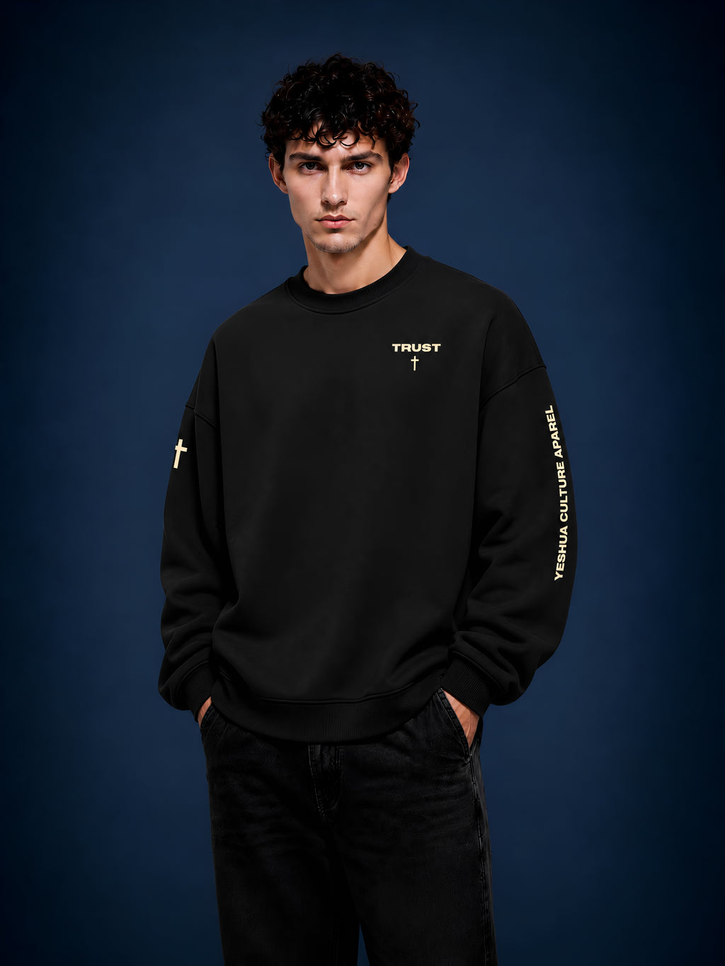 Man wearing TRUST oversized Christian crewneck sweater, front chest cross detail