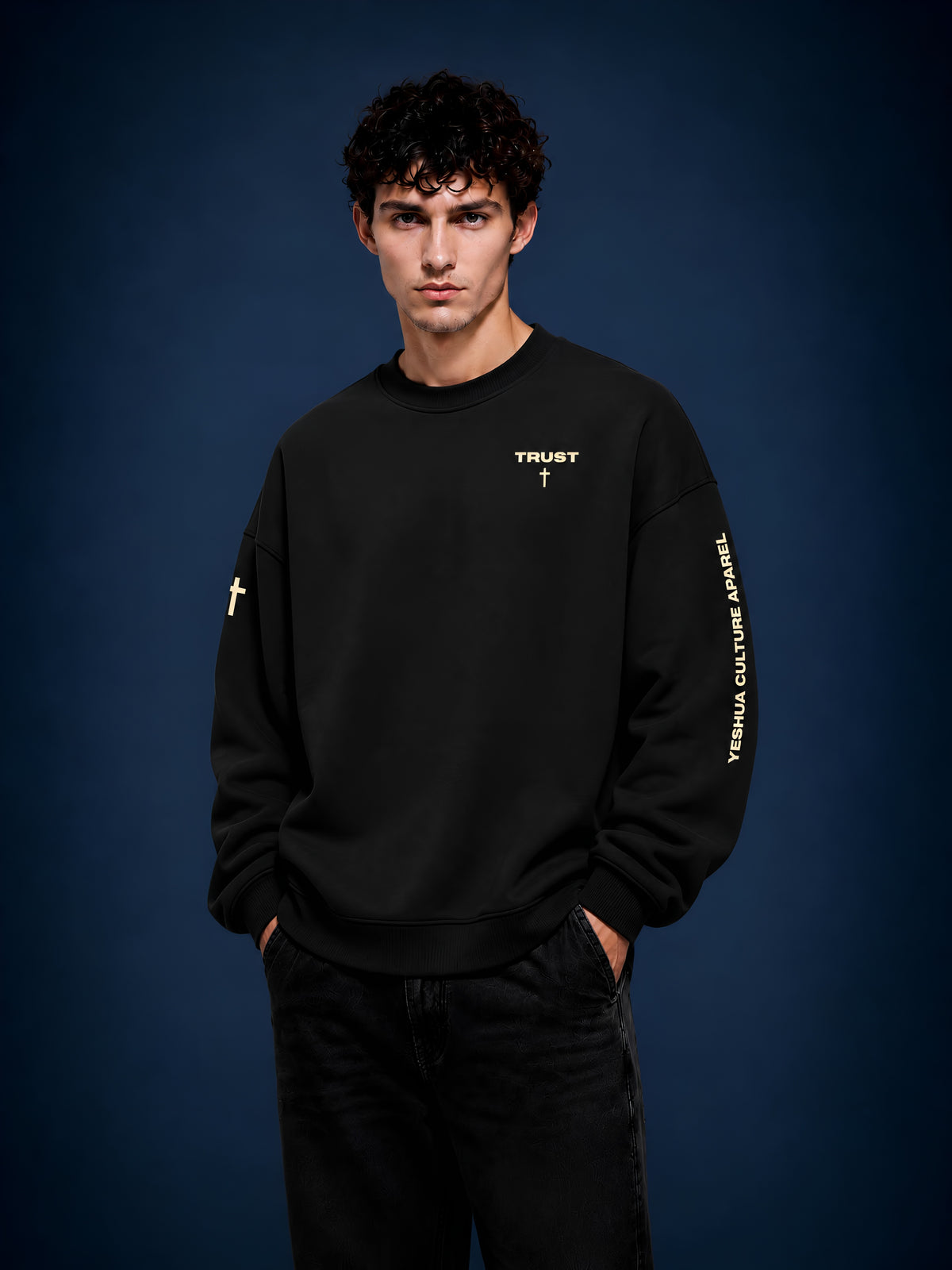 Man wearing TRUST oversized Christian crewneck sweater, front chest cross detail